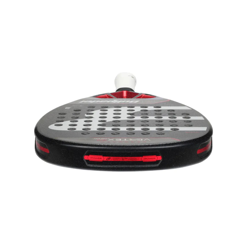 The Bullpadel Vertex 04 Comfort 2024 Martín Di Nenno is a red and black padel racket with perforated face, brand logos, and a diamond-shaped head. Wrapped in white grip tape, it boasts a sleek aerodynamic design with the CURVAKTIV system for enhanced performance.