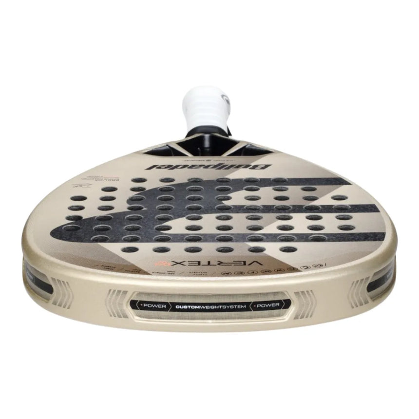 Close-up of a BullPadel padel racket labeled BULLPADEL VERTEX 04 WOMAN 2025 DELFI BREA. It features a beige, black, and white design with Bullpadel-Lab technologies, a perforated textured surface, and a white grip handle. Perfect for expert players.