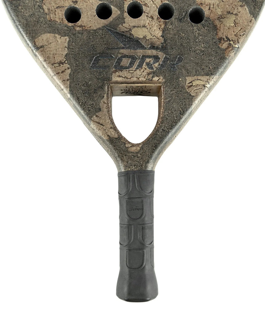 Close-up of the textured Cork Padel Extreme Black paddle with a black grip, holes near the top, and the logo centered. The rough pattern highlights its high-performance innovation and frequent use by Cork Padel.