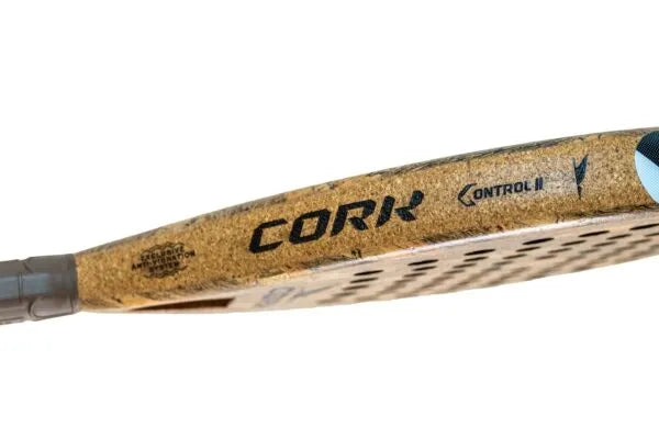 Close-up of a Cork Padel Premium Control II, designed for Advanced Players. It features a cork surface with CORK, CONTROL II, and the Cork Padel logo on the side. Its textured grip handle ensures precision, and the brown color scheme with black text adds sophistication.