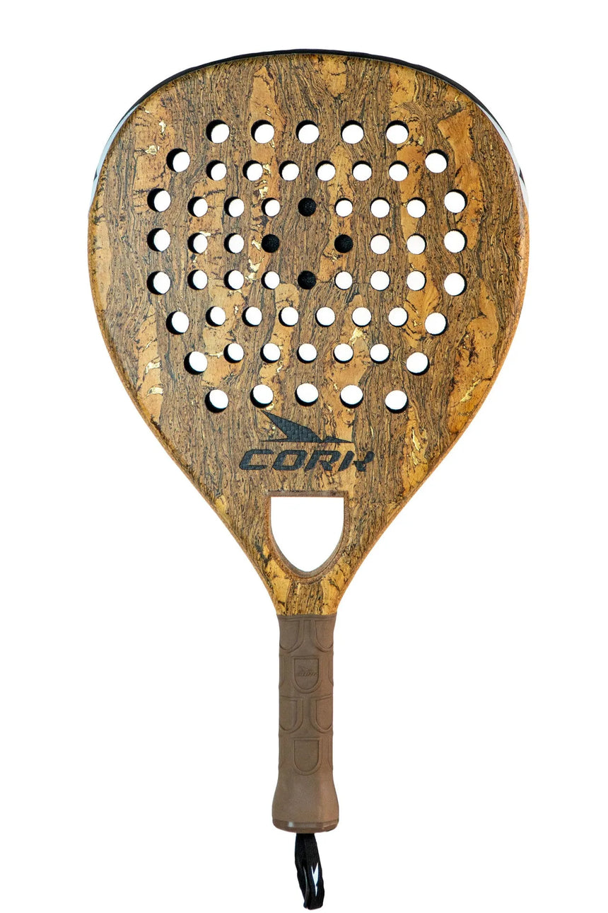 The Cork Padel Premium Control II, designed by Cork Padel, is a wooden racket for advanced players. It features circular holes for precision, a textured brown design with a top logo, and includes a wrist strap on the handle—a premium control choice for serious players.