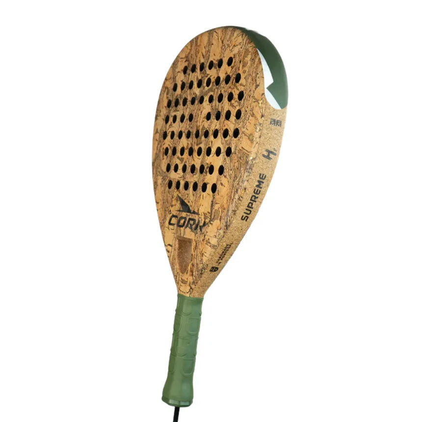 Introducing the Cork Padel Supreme Hybrid III: a padel racket featuring a cork-textured surface and vibrant green grip. Enhanced with multiple holes for optimal performance, it proudly displays the Cork Padel brand.
