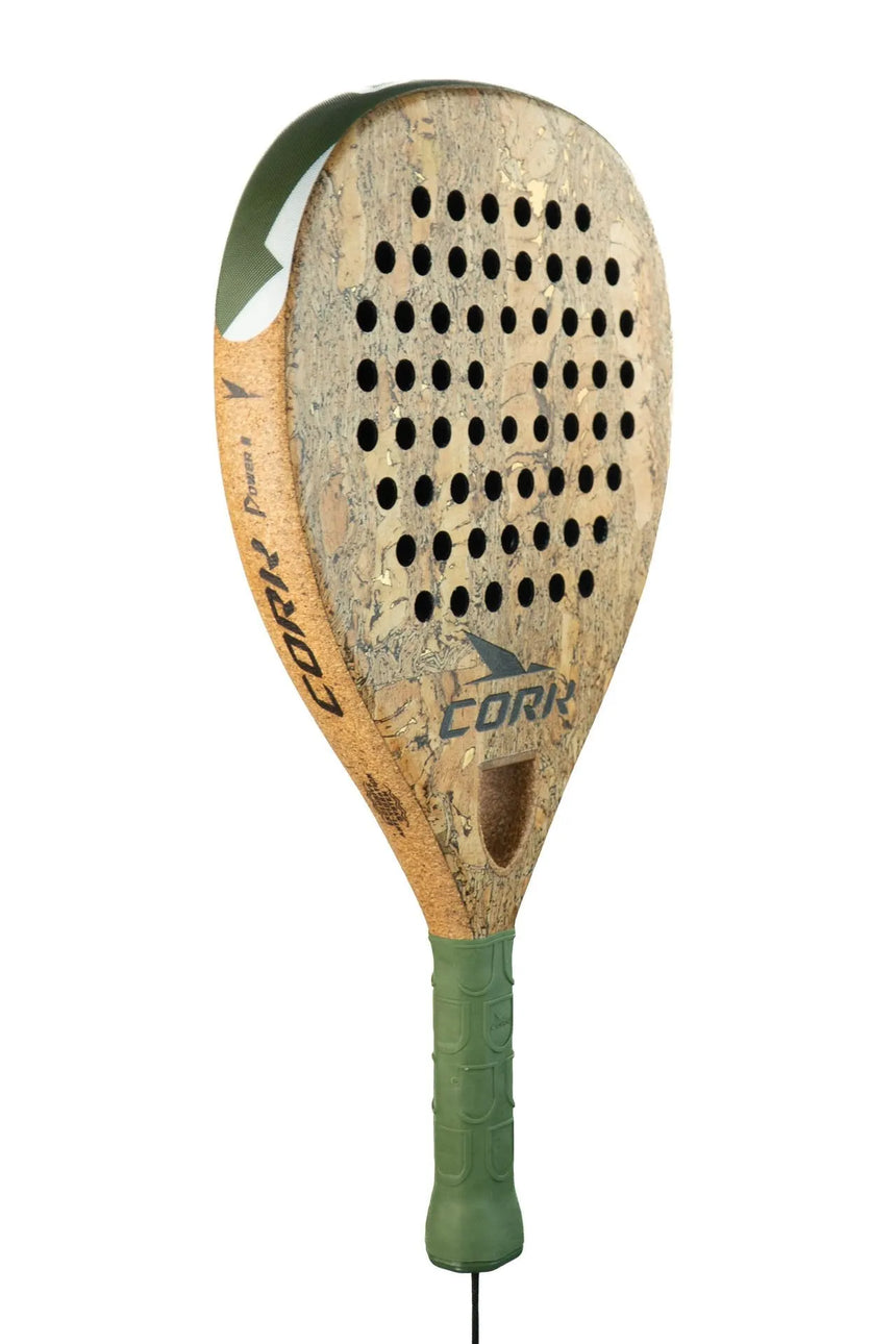 The Cork Padel Supreme Power III racket for offensive players boasts a cork-textured surface and multiple holes. Its thick high-carbon frame is paired with a green grip handle, prominently displaying the Cork Padel brand against a pristine white background.
