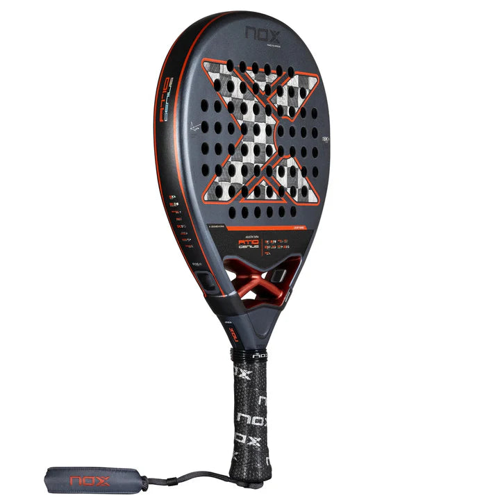 The Nox Padel Racket AT10 Genius 18K Alum 2025 by Agustin Tapia features a striking black and orange color scheme with a prominent X at its center. Made with 18K Carbon Alum and Exclusive Spin Technology, it offers exceptional gameplay with its textured surface and precise holes. The black grip displaying nox adds to its sleek design.