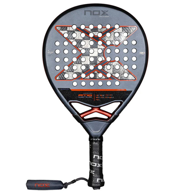 The Nox Padel Racket AT10 Genius 18K Alum 2025 by Agustin Tapia is a black and gray padel masterpiece with red accents and numerous holes for enhanced play. It features a black grip handle with NOX branding, Exclusive Spin Technology, and 18K Carbon Alum for superior performance.
