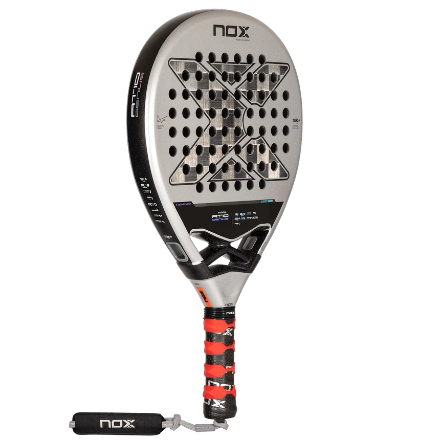 The NOX Padel Racket AT10 Genius 18K by 2024 Agustin Tapia features a sleek black and silver design, a bold X at the core, and a tricolor grip with wrist strap. Made from aluminized carbon fiber and incorporating EOS Flap technology, it proudly displays the NOX signature.