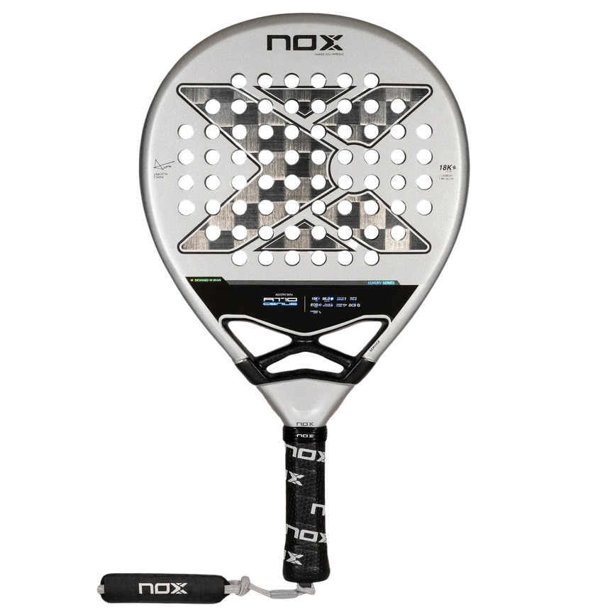 The NOX Padel Racket AT10 Genius 18K by 2024 Agustin Tapia features a circular head with a geometric hole pattern, crafted from aluminized carbon fiber for durability. Its gray and black design matches the handle, wrapped in a black grip with NOX branding.
