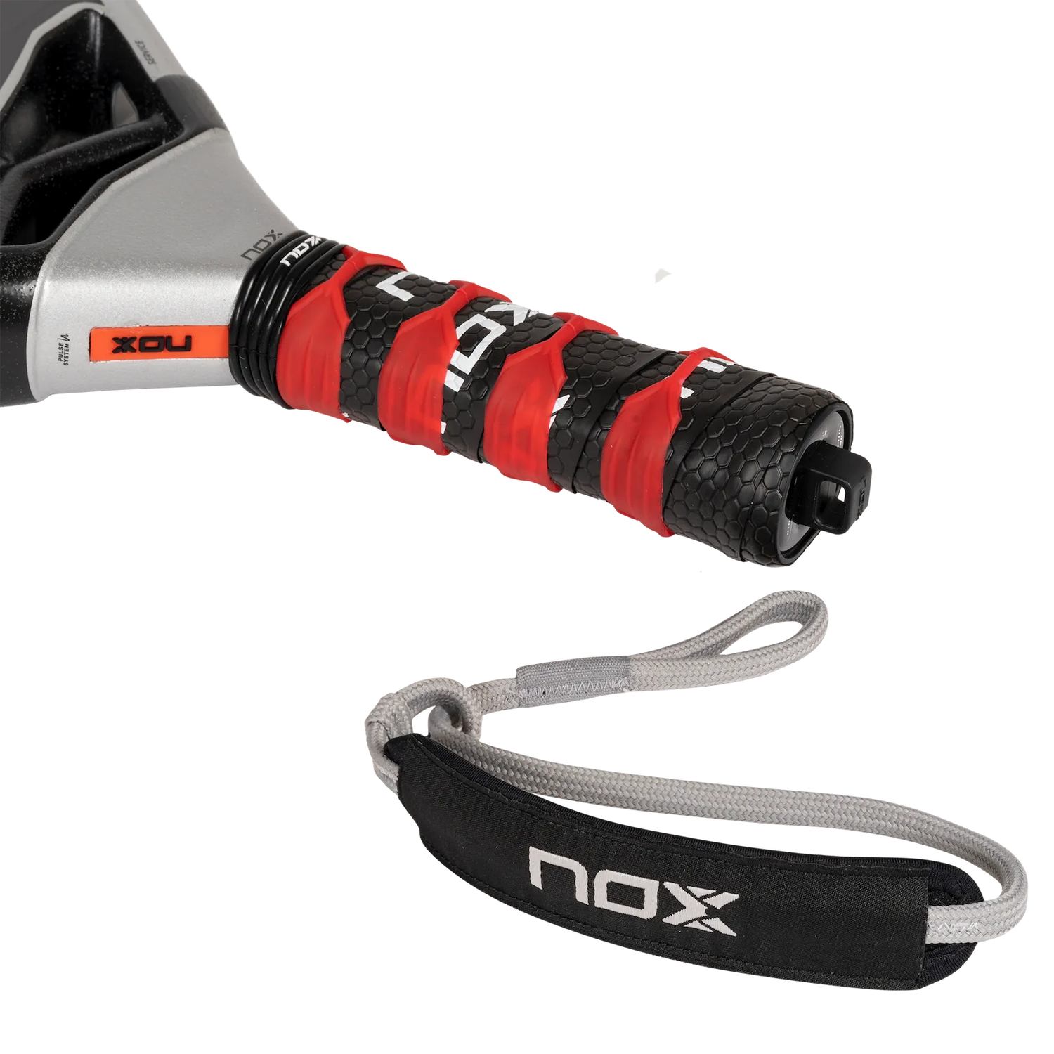 Close-up of the NOX Padel Racket AT10 Genius 18K handle, wrapped in black and red grip tape. Enhanced with EOS Flap technology, it includes a gray wrist strap showing the NOX brand and features a textured, contrasting color design.