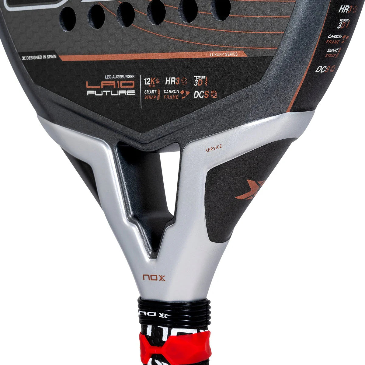 The NOX Padel Racket LA10 Future 2024, endorsed by Leo Augsburger, is a black and silver racket with orange accents made from aluminized 12K carbon fiber for power. It features HR3, Carbon Frame, and DCS details and a black handle with a red band at the bottom.