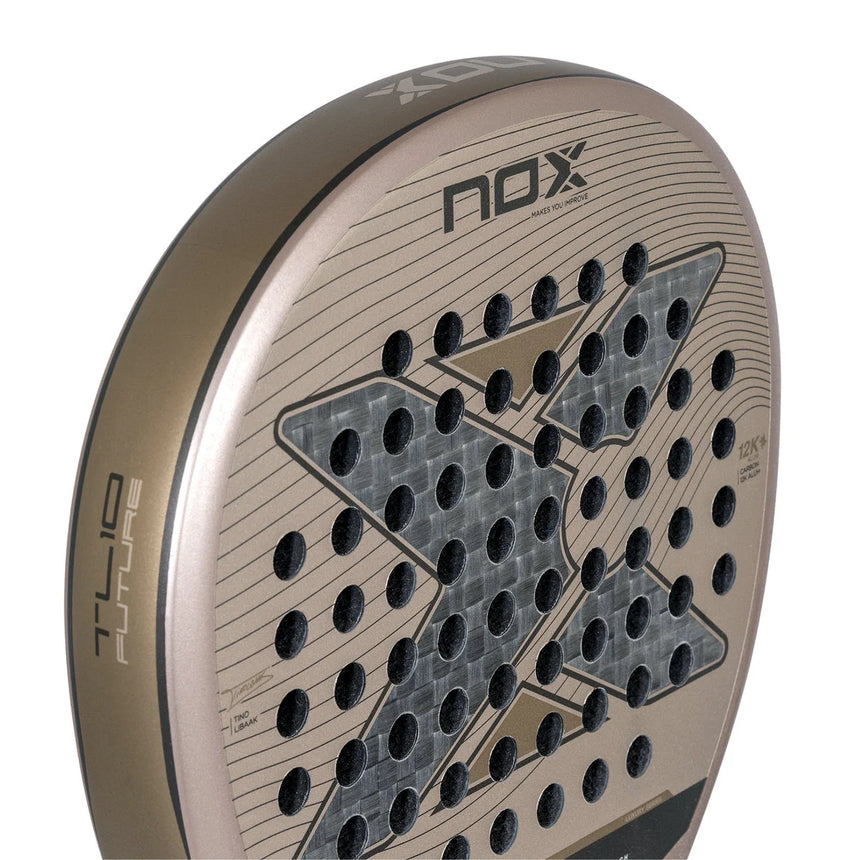 The NOX Padel Racket TL10 Future 2024 Tino Libaak features a bronze frame with a perforated surface, a large black X design, and NOX on top with AT10 FUTURE on the side. Its made from Aluminized 12K Carbon Fiber for versatile gameplay.