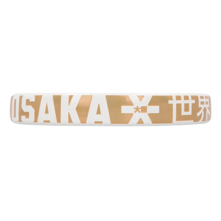 A white wristband with gold and white lettering, showcasing OSAKA boldly, pairs perfectly with your Osaka Padel Racket Pro Tour Control 2024 (Like New).