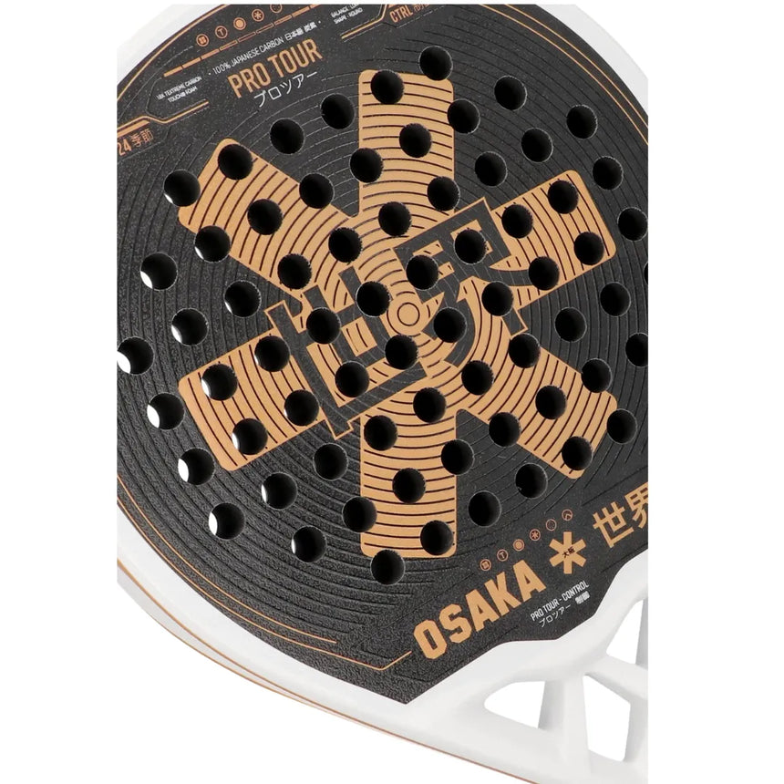 Close-up of the Osaka Padel Racket Pro Tour Control 2024, showcasing its black and orange design with circular holes. PRO TOUR CONTROL and OSAKA are prominent, alongside Japanese characters. Made with 18K Textreme Carbon, it features a sleek white rim to enhance performance.