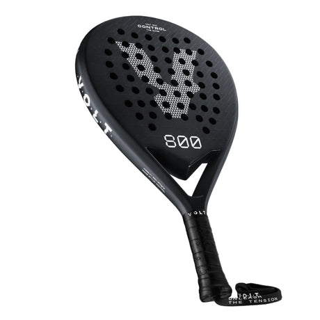 The VOLT 800 V4 Padel Racket by Volt features 800 Control on its frame and handle. Its face has a geometric design, enhanced with shock absorption technology and a 3K carbon structure for top performance. The ergonomic handle includes a wrist strap for convenience.