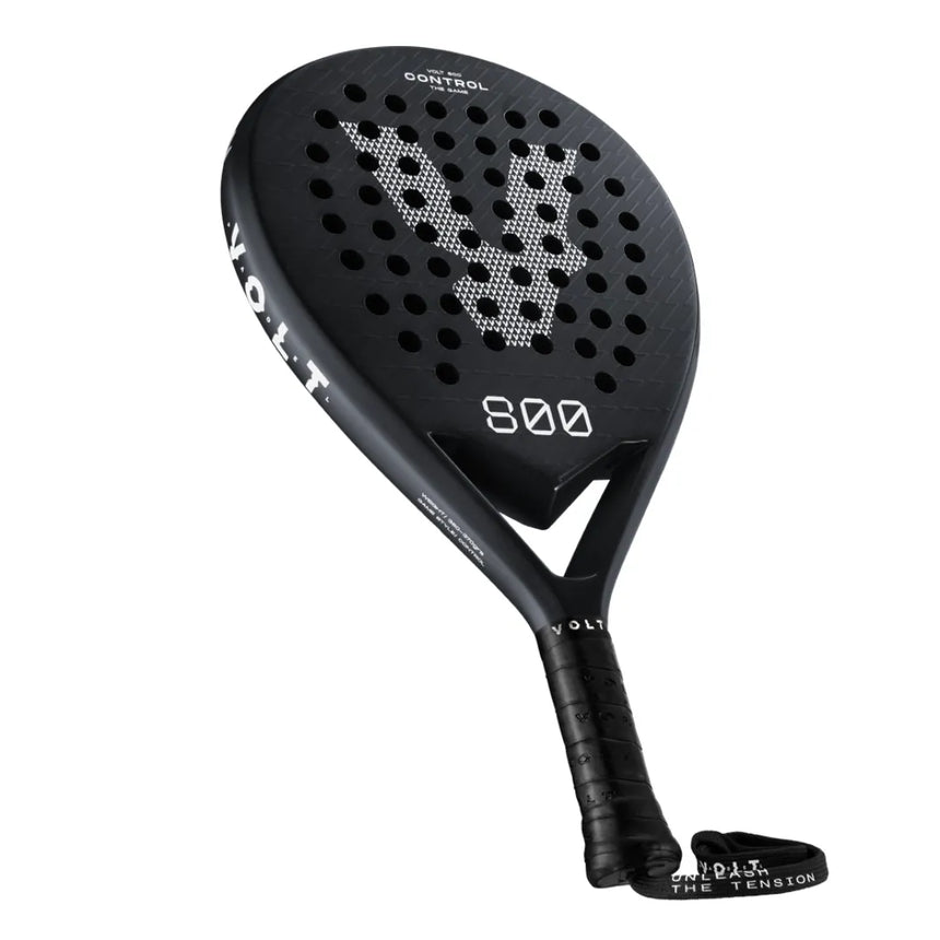 The VOLT 800 V4 Padel Racket by Volt features 800 Control on its frame and handle. Its face has a geometric design, enhanced with shock absorption technology and a 3K carbon structure for top performance. The ergonomic handle includes a wrist strap for convenience.