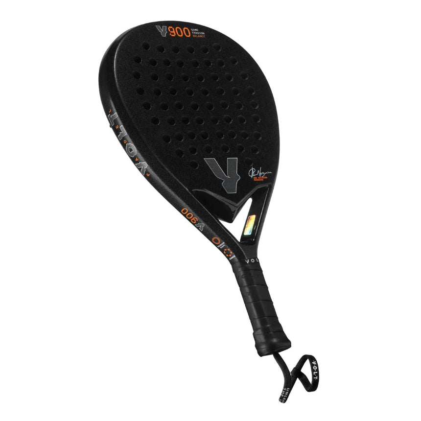 The VOLT 900 V23 padel racket by Padel Smash Academy is black with a textured surface and circular holes. It features V900 in orange, Ana Catarina Nogueiras signature, a black handle, wrist strap, and is crafted from durable 3K carbon.