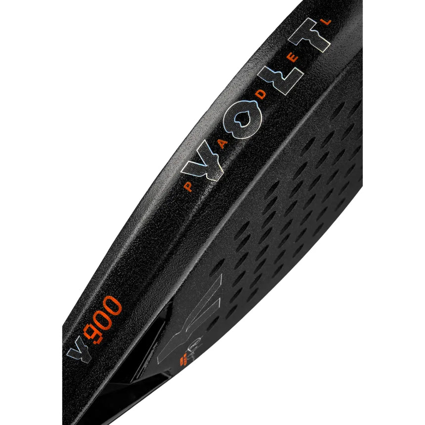 Close-up of a black VOLT 900 V23 padel racket by Padel Smash Academy, featuring an orange and white Volt logo. Its 3K carbon surface has a textured pattern with CODE 4 text, and small edge cutouts for weight reduction. Designed like those used by Ana Catarina Nogueira.