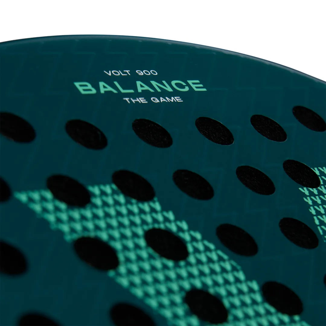 Close-up of the VOLT 900 v4 padel racket by Volt, showing BALANCE THE GAME. The dark green surface has small black dots in a triangular pattern, with a textured design and durable 3K Carbon Structure.