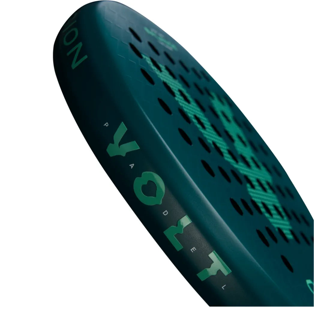 The image showcases a dark blue Volt VOLT 900 v4 padel racket with teal accents, featuring a 3K Carbon Structure with honeycomb patterns and circular holes. The background is white.