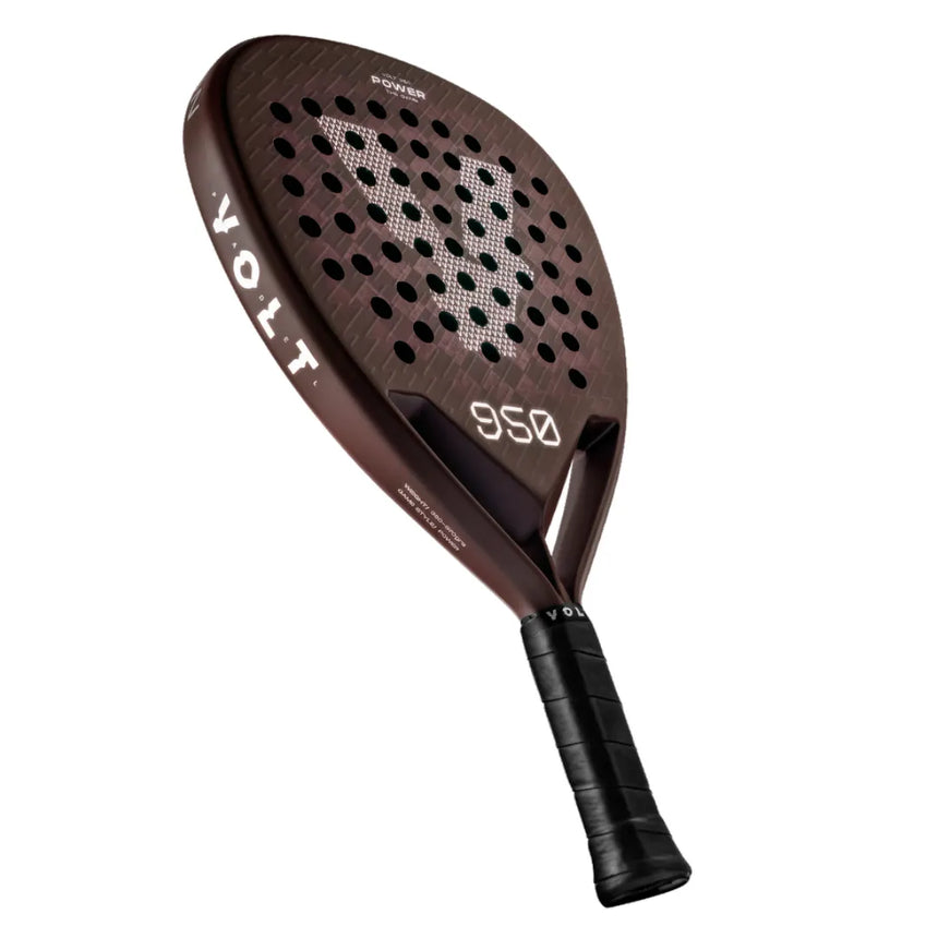 Introducing the VOLT 950 v4 padel racket, featuring a brown design with a black handle, advanced 3K Carbon Structure for top-notch performance, and a perforated surface for improved aerodynamics. The VOLT logo is prominently on the face above 950.