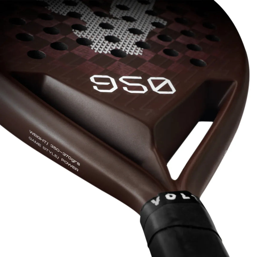 A close-up of a brown Volt VOLT 950 v4 padel racket shows circular holes and VOLT 950 V4 printed in white. The handle features 3K Carbon Structure and GAME STYLE: POWER.