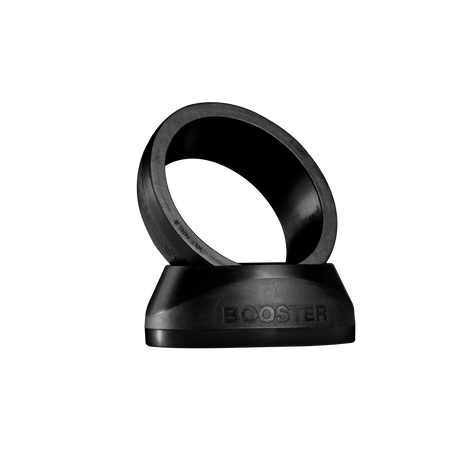The sleek VOLT BOOSTER by Volt is a black ring with BOOSTER embossed, angled on a matching base against a dark backdrop. This padel racket accessory combines modern aesthetics with a power boost for your game.