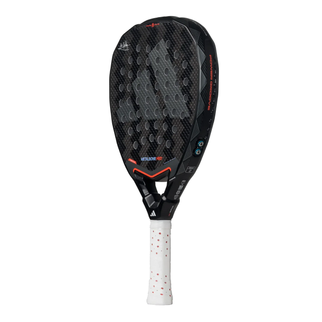 The Adidas Metalbone HRD+ 3.4 Ale Galan 2025 padel racket, designed for offensive play, has a black and gray honeycomb-patterned face with red accents, a white grip, and small blue decorative elements on the frame. The brand logo is prominent for easy customization.