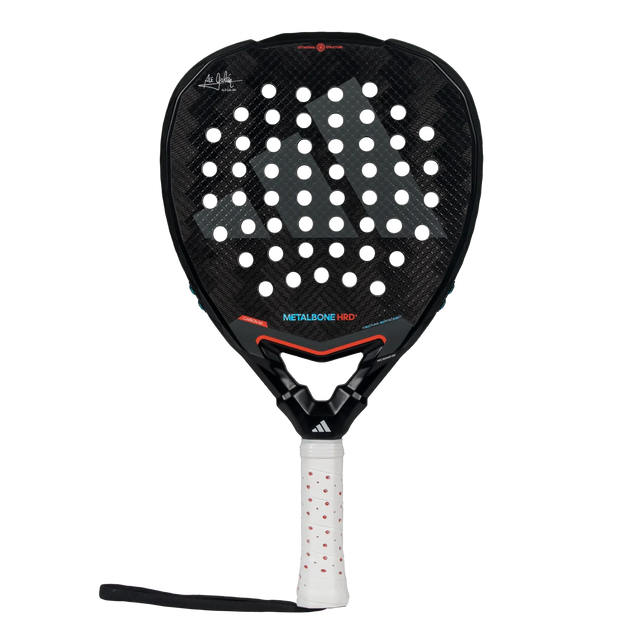 The Adidas Metalbone HRD+ 3.4 Ale Galan 2025 padel racket features a perforated black surface with red accents. Tailored for offensive play, its handle includes a white grip with red dots, allowing match customization.