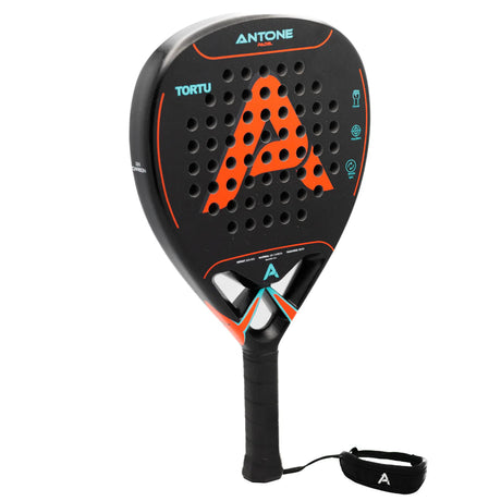 The Antone Padel Tortu is a black and orange racket featuring a bold orange A, evenly distributed holes, and 12K carbon construction. It has a wrist strap for secure play, with the brand name prominently displayed on top.
