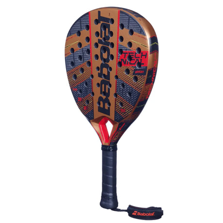 The Babolat Technical Veron 2024 Padel Racket, featuring CARBON FLEX, comes with a black grip and wrist strap. It showcases a geometric pattern in red, gold, and black with Babolat and Tech Nyx, perfectly matching the Technical Veron series.
