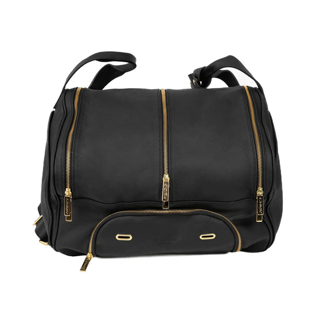 An exclusive Portuguese Cork Padel product, the Cork Padel Leather Thermobag is crafted from black genuine leather and includes three spacious zipped compartments with gold zippers. It features two sleek leather handles and small metal studs on the bottom for extra durability.