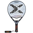 The Nox Padel Racket AT Pro Cup Comfort 25 by Agustín Tapia features a gray and black design with a large X and multiple holes. It uses Fiber Glass Silver construction, has a black grip with NOX in orange, and includes a wrist strap for comfort.