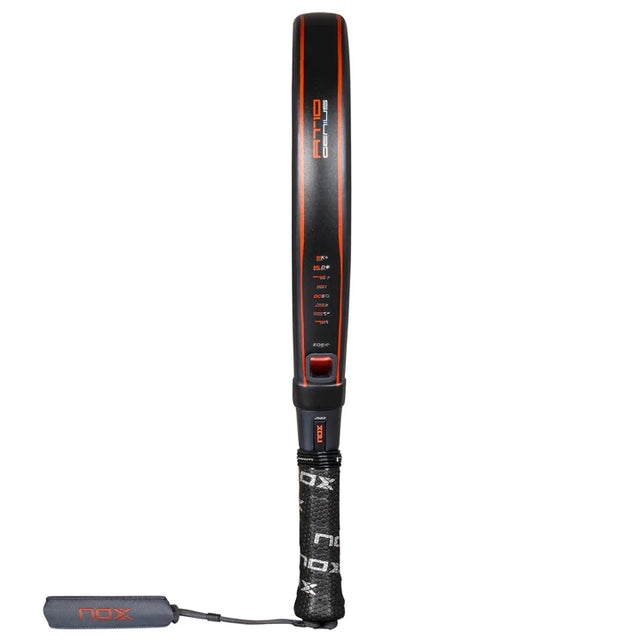 The Nox Padel Racket AT10 Genius 18K Alum 2025 by Agustin Tapia combines a black frame with red accents featuring Exclusive Spin Technology. Made from 18K Carbon Alum, this stylish NOX racket has a visible string pattern and detachable wrist strap to enhance performance.