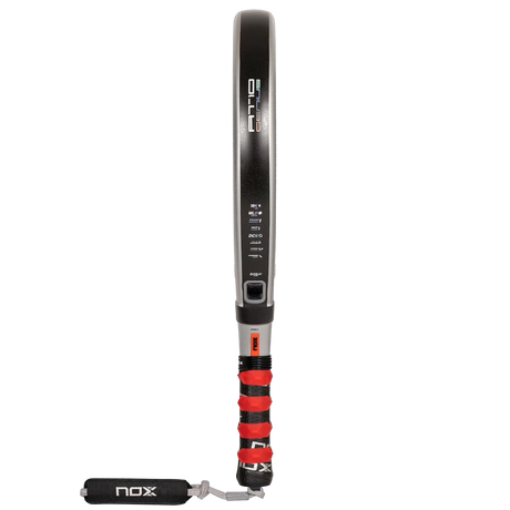 The NOX AT10 Genius 18K padel racket by Agustín Tapia, available at Padel Smash Academy, features EOS Flap technology, a sleek black frame with red grip, side branding and specs, and a wrist strap imprinted with NOX.