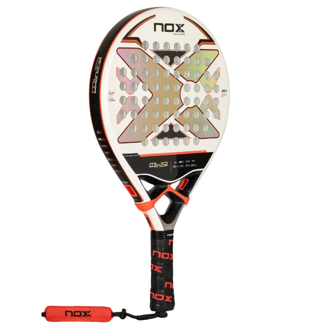 The NOX Padel Racket ML 10 Pro Cup Luxury 2024, designed by Miguel Lamperti, is red and black with a perforated surface and hexagonal pattern. Made from 3K carbon fiber, it features EOS Flap technology and has a branded handle with a matching wrist strap. The brand NOX is displayed on the face.