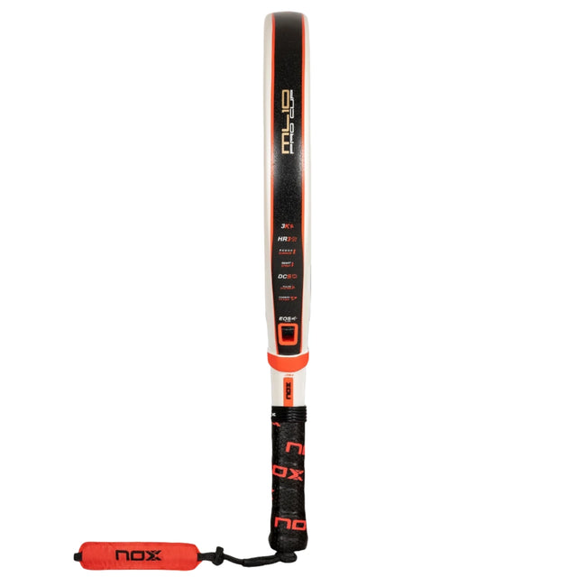 The NOX Padel Racket ML 10 Pro Cup Luxury 2024 features a black and orange hybrid-style design with a white edge, constructed from 3K carbon fiber. It includes an adjustable Nox grip strap and displays multiple logos, plus EOS Flap technology along the side.