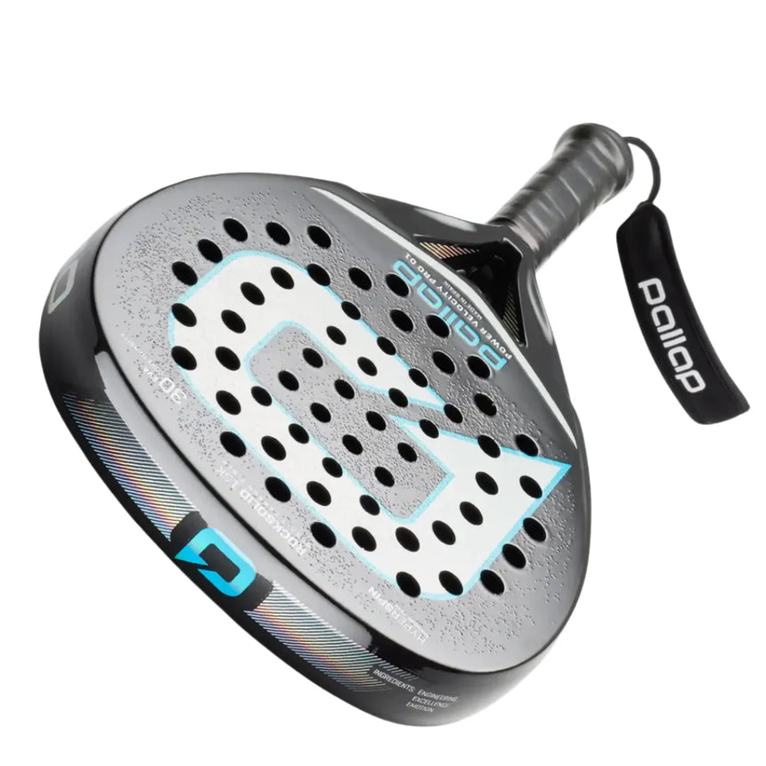 Close-up of the Pallap PALLAP POWER VELOCITY PRO 01 padel racket in black and silver with a large G logo, perforated face, Basalt-Carbon frame, and a logo tag on the black grip. The HYPERSPIN surface ensures excellent grip and spin control for optimal performance.