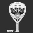 The SKULL PADEL V1100 - WHITE LEAF 24K (LIKE NEW) by Skull Padel is a white racket with a black feather design, crafted from carbon fiber. It features a perforated pattern on a dark background, and the handle has white tape labeled Skull Padel, offering a secure grip and an attached wrist strap.