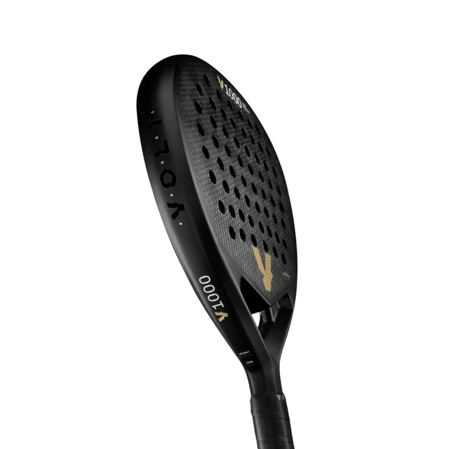 The black VOLT 1000 V23 padel racket from Volt features a perforated surface and diamond-shaped blade for aggressive play. Its sleek, modern design is enhanced with gold and white lettering for top court performance.