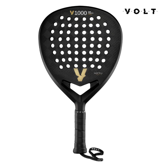 The VOLT 1000 V23 padel racket by Volt is tailored for aggressive players, featuring a diamond-shaped blade with a perforated surface, VOLT branding, and a bold V design at the center. It has a black handle with a wrist strap and displays Volt 1000 V23 at the top.