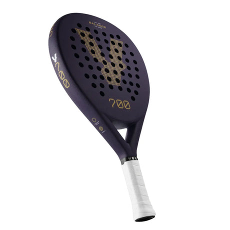 The VOLT 700 v4 padel racket by Volt features a stylish purple design with a unique V pattern of small holes. Its 3K carbon structure provides durability, the white-taped handle ensures comfort, and the slightly rounded head offers better playability with flexible shock absorption technology to reduce impact.