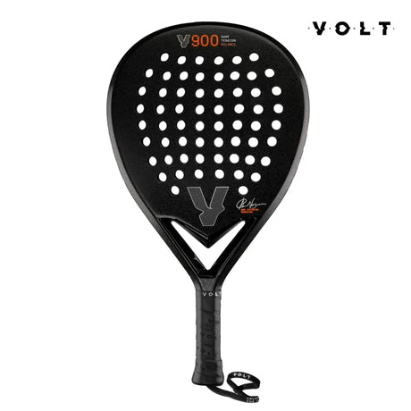 The VOLT 900 V23 padel racket from Volt features a black perforated head made of 3K Carbon for durability. It elegantly displays the brand and model, offers a teardrop balance, and includes a wrist strap on the handle for better grip.
